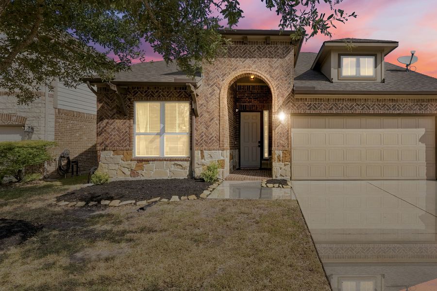 Twilight exterior photo of a home in Cypress